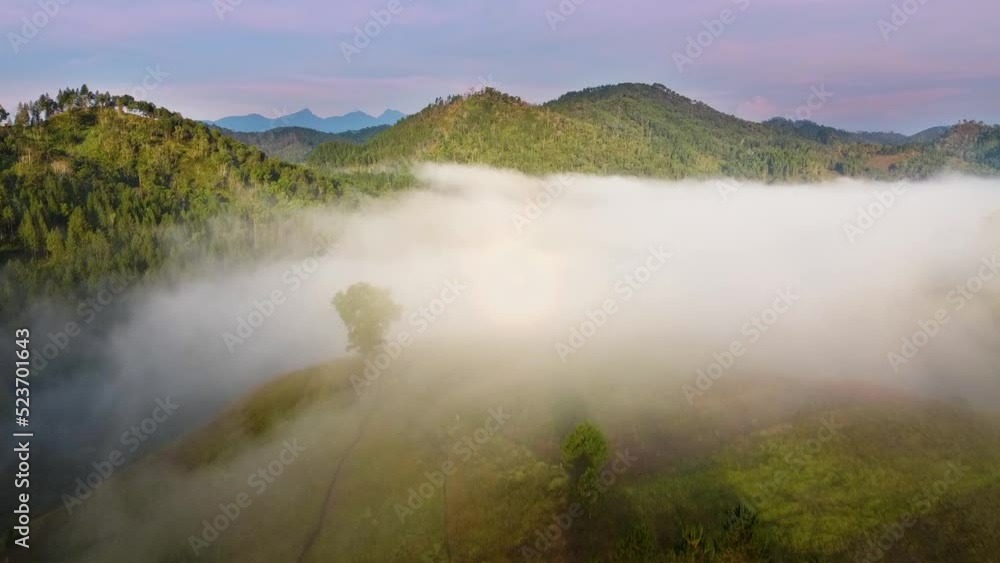 Drone shot of a foggy mountain Drone shot of a foggy mountain
