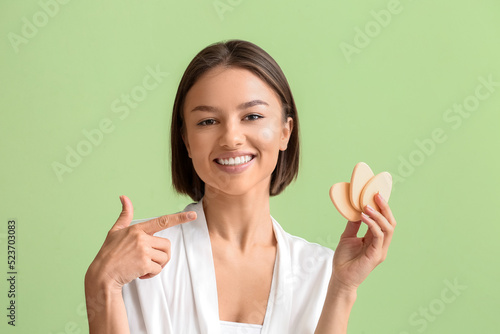 Pretty young woman pointing...