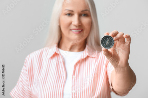 Mature woman with compass o...