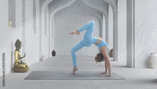 Young athletic attractive woman practicing yoga.