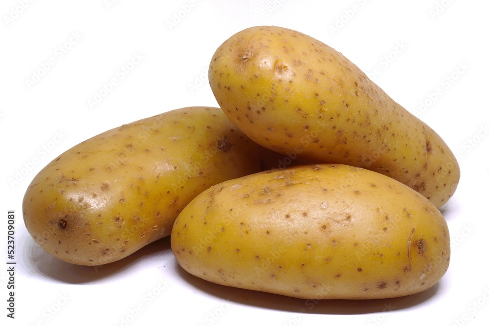 white background photo Three potatoes stacked together.