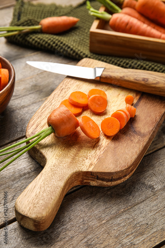 Board with cut carrot and k...