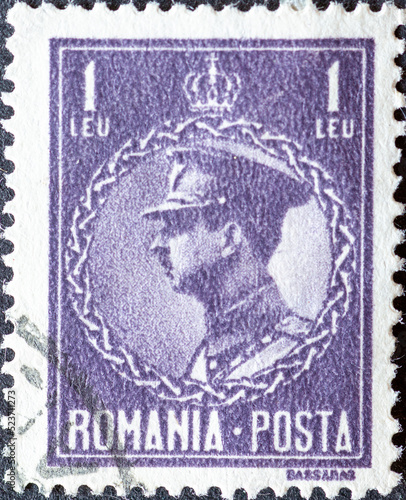 ROMANIA - CIRCA 1932: a postage stamp from Romania , showing a portrait of Carol II of Romania (1893-1953) in military uniform with peaked cap. Circa 1932