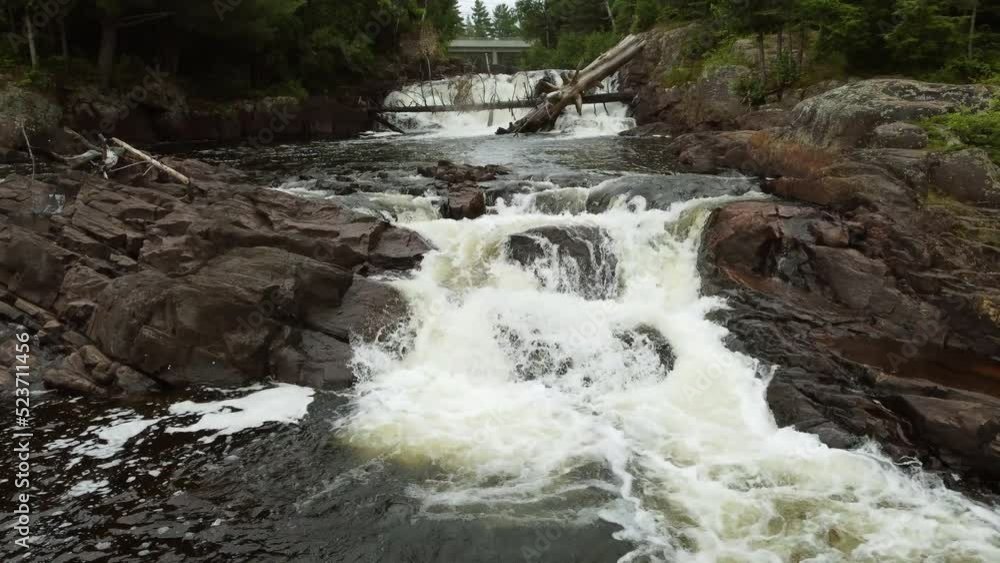 Drone flying low over fresh water cascade in Algonquin park, Ontario. Canada Drone flying low over fresh water cascade in Algonquin park, Ontario. Canada