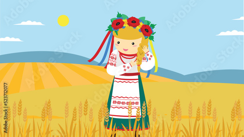 A girl in a Ukrainian vyshyvanka and a wreath braids a braid in a field