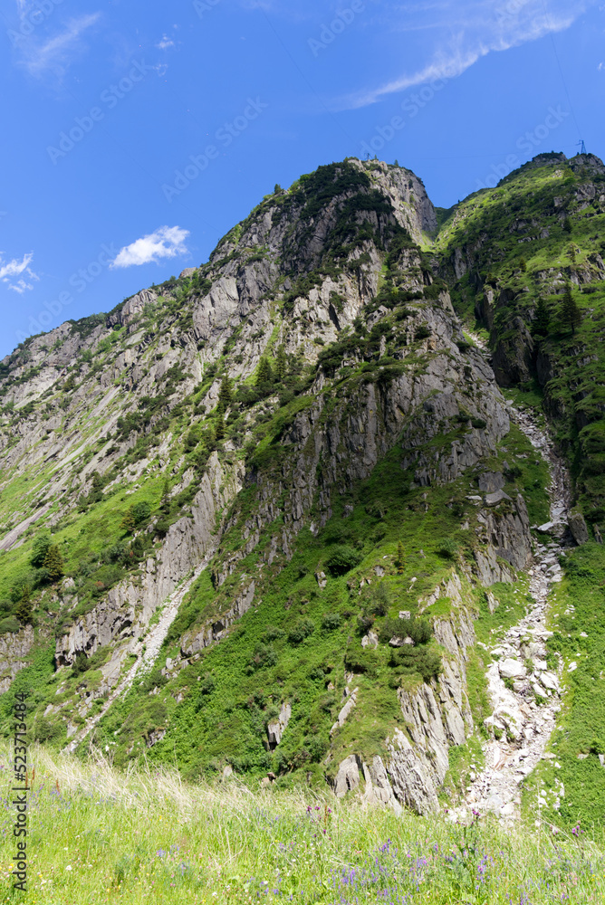 Scenic view of rocks and mountains at Schöllenen Gorge, Canton Uri, on a sunny summer day. Photo taken July 3rd, 2022, Schöllenen Gorge, Switzerland. Scenic view of rocks and mountains at Schöllenen Gorge, Canton Uri, on a sunny summer day. Photo taken July 3rd, 2022, Schöllenen Gorge, Switzerland.