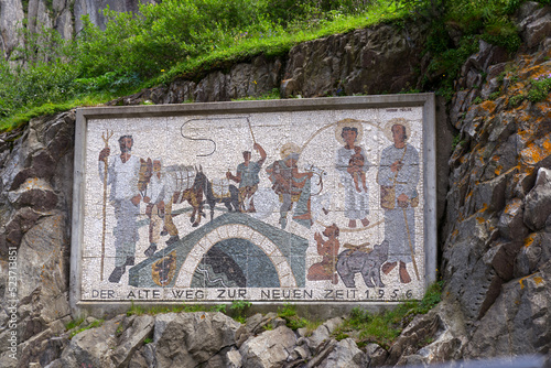 Painting of Devil's bridge at Schöllenen Gorge at Swiss Alps on a sunny summer day. Photo taken July 3rd, 2022, Schöllenen Gorge, Switzerland. photo