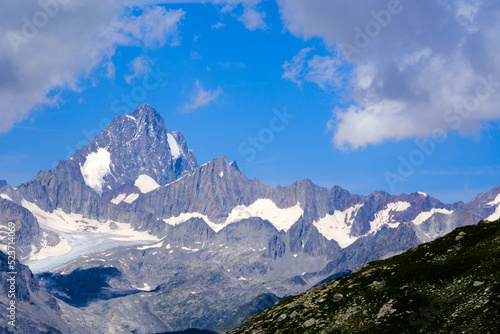 Fototapeta Naklejka Na Ścianę i Meble -  Swiss Alps with Rhone Glacier seen from Swiss mountain pass Nufenen on a sunny summer day. Photo taken July 3rd, 2022, Nufenen Pass, Switzerland.