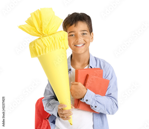 Smiling schoolboy holding c...