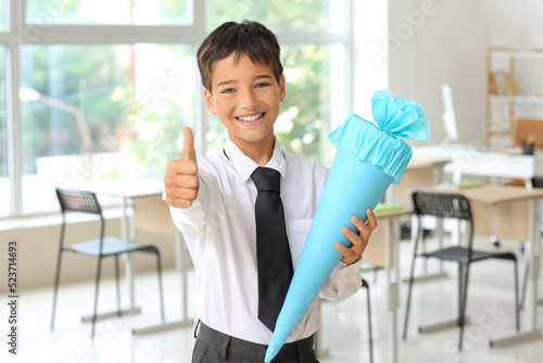 Little boy with blue school...
