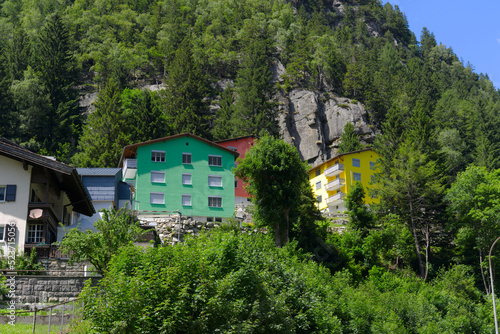 Mountain village Göschenen with beautiful colored houses on as sunny summer day. Photo taken July 3rd, 2022, Göschenen, Switzerland.