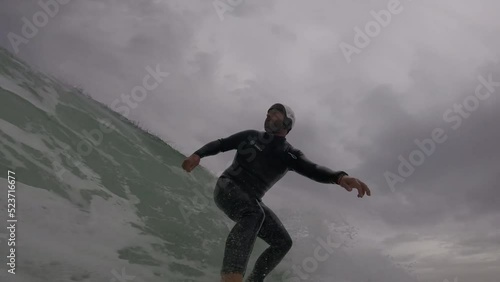 Wallpaper Mural 4K view of man surfing in Arriba beach surrounded by some clouds. Atlantic coastline. Cascais, Portugal. surf power in guincho Torontodigital.ca
