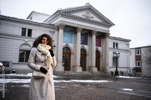 woman in the city in front of a old town hall © kennypool