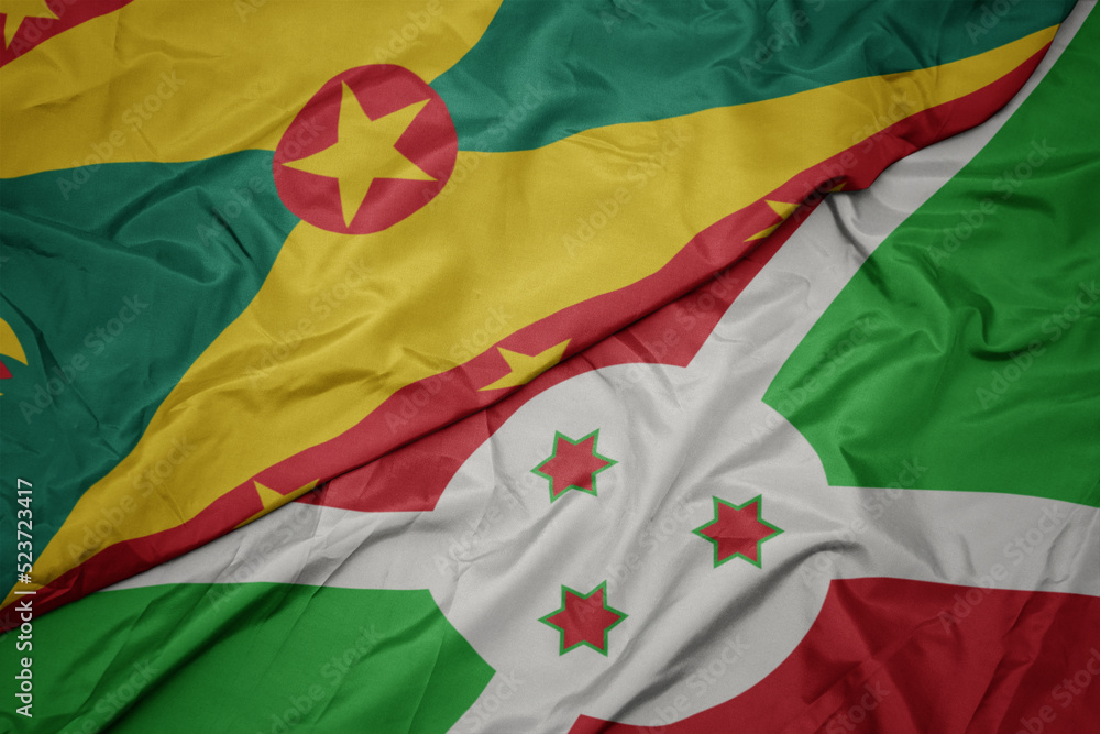waving colorful flag of burundi and national flag of grenada. waving colorful flag of burundi and national flag of grenada.