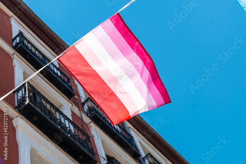 lgbt flags hanging in the streets at the pride party in madrid, lesbian flag