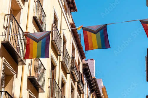 lgbt flags hanging in the streets and balconies at the pride party in madrid