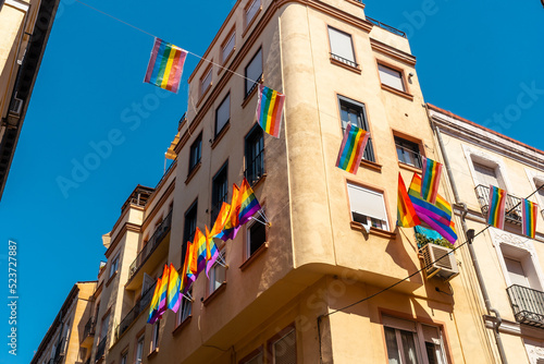 lgbt flags hanging in the streets and balconies at the pride party in madrid photo