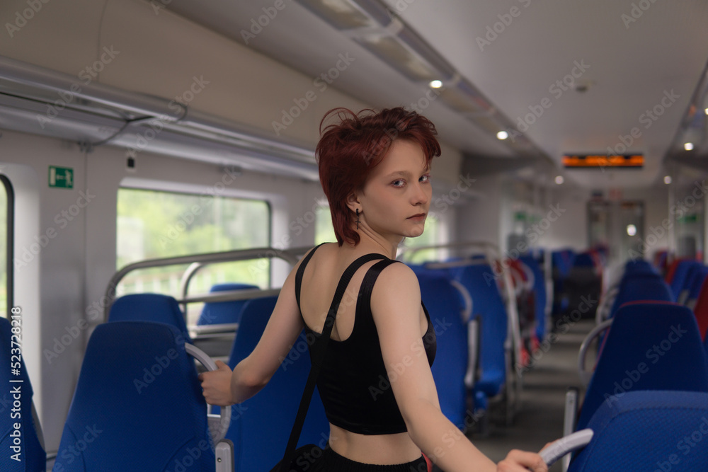 Obraz premium teenager girl in a commuter train car