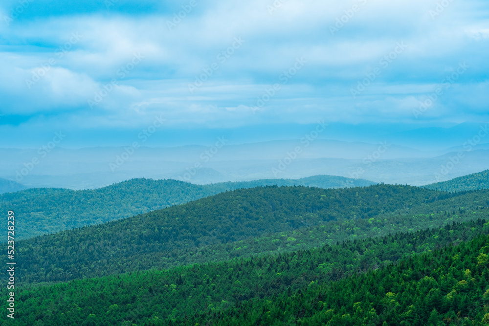 aerial view of wild wooded hills on a cloudy day