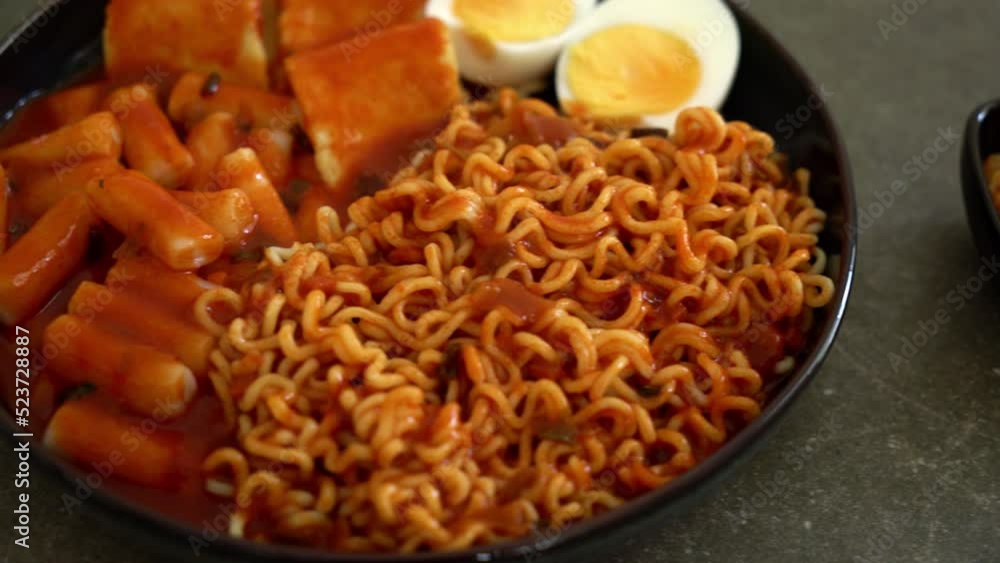 Korean instant noodles with Korean rice cake and fish cake and boiled egg - Rabokki - Korean food style Korean instant noodles with Korean rice cake and fish cake and boiled egg - Rabokki - Korean food style