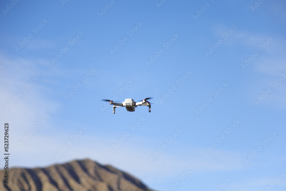 drone quadcopter with digital camera on blue sky drone quadcopter with digital camera on blue sky