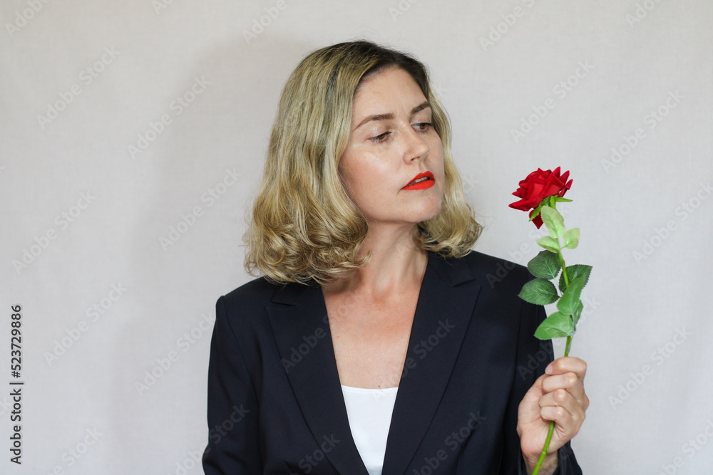 Beautiful middle-aged blond woman on a white background Beautiful middle-aged blond woman on a white background