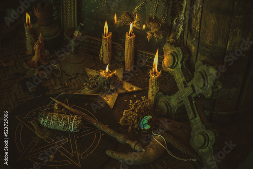 Fotografie Candle burns on the altar, magic among candles, clean negative energy, wicca con