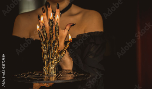 Fotografie, Obraz Candle burns on the altar, magic among candles, clean negative energy, wicca con