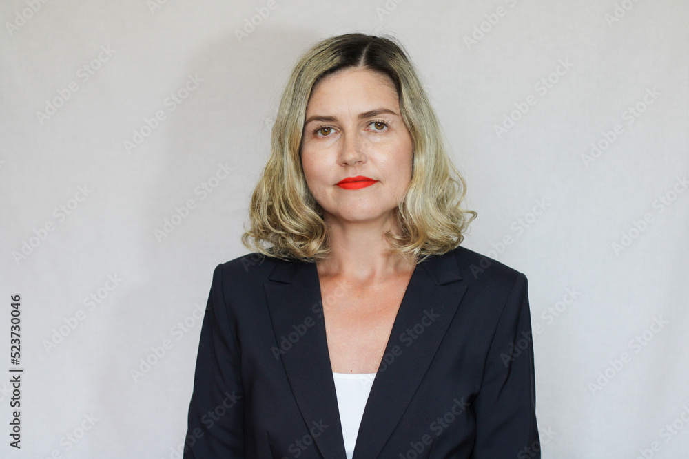 Beautiful middle-aged blond woman on a white background Beautiful middle-aged blond woman on a white background