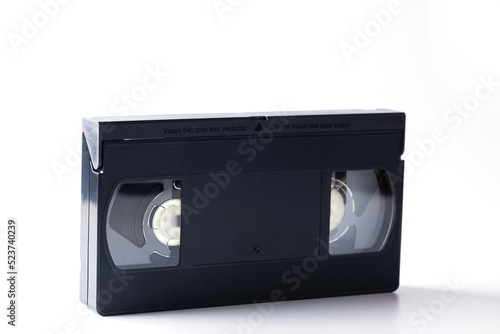 Black plastic video cassette on a white background.