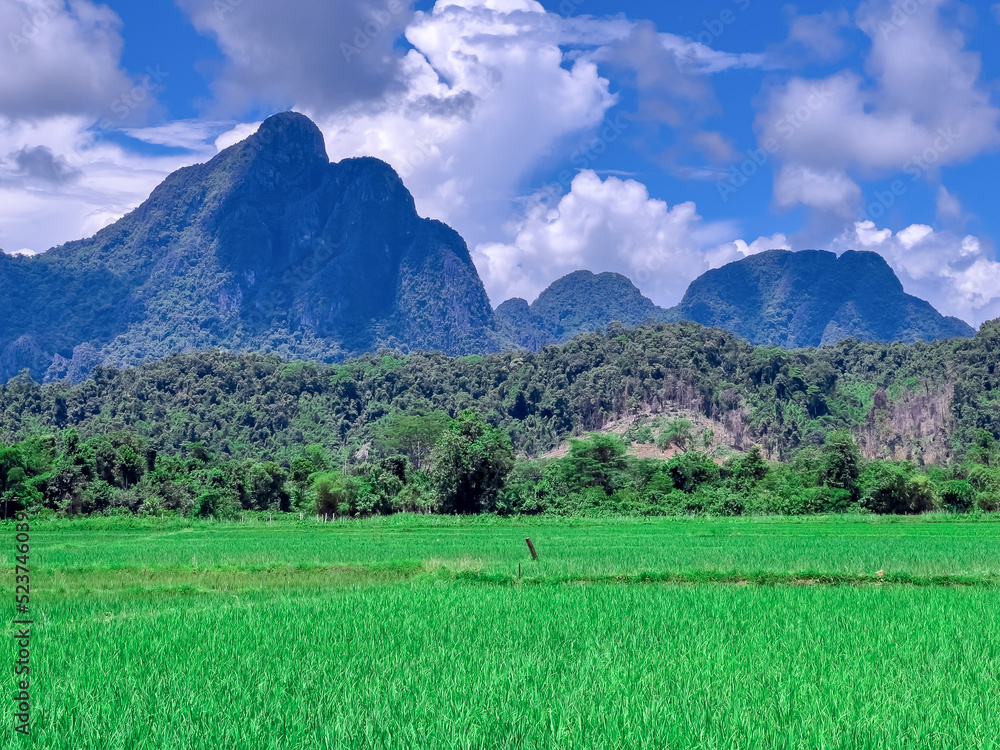 Vang Vieng Laos a beautiful city on the river with huge rising mountains and slow flowing river. 