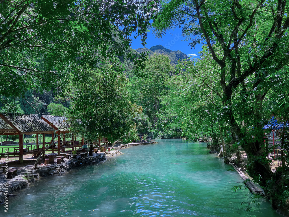 Beautiful Blue Lagoon waters in Vang Vieng Laos. Surrounded by beautiful mountains and trees