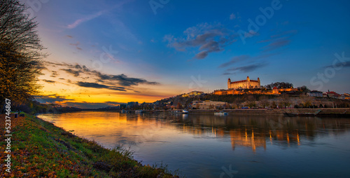 Photography Sunset over Bratislava castle, Slovak parliament and Danube river in Slovakia