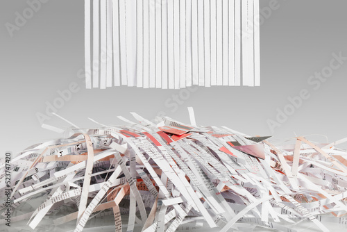 Blank Shredded paper  above Cut up credit cards on Shredded Bills and Bank Statements