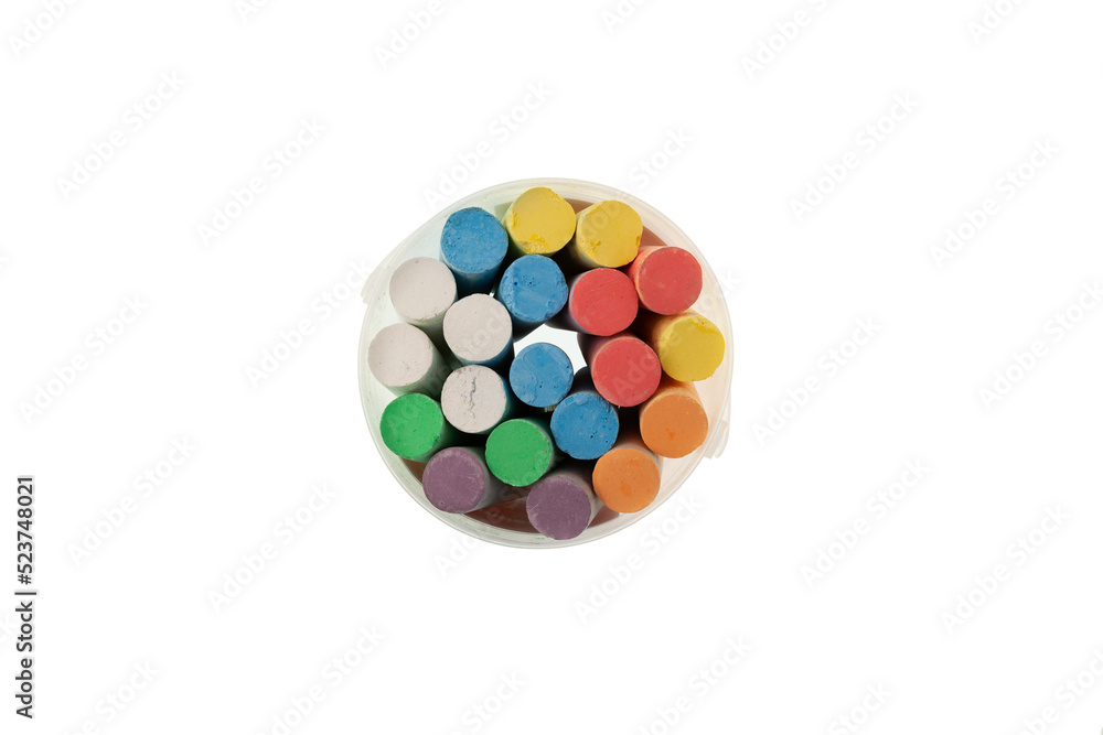 Chalks in plastic box on white background, top view. Colored crayons for drawing on asphalt or blackboard. Back to school background Chalks in plastic box on white background, top view. Colored crayons for drawing on asphalt or blackboard. Back to school background