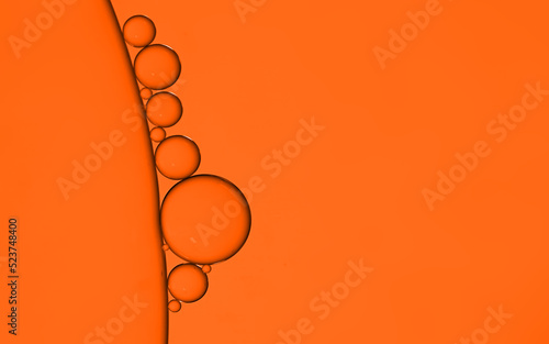 Oil bubble on orange background.