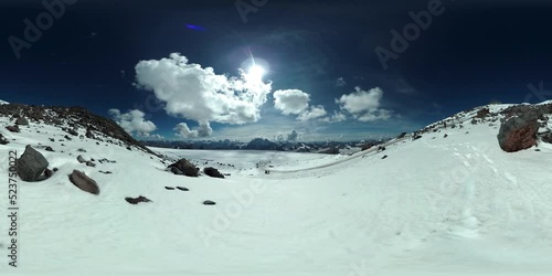 360 VR video of the snowy slopes of mount Elbrus at Caucasus Mountains. Tourists coming down the moutain. September, 2018