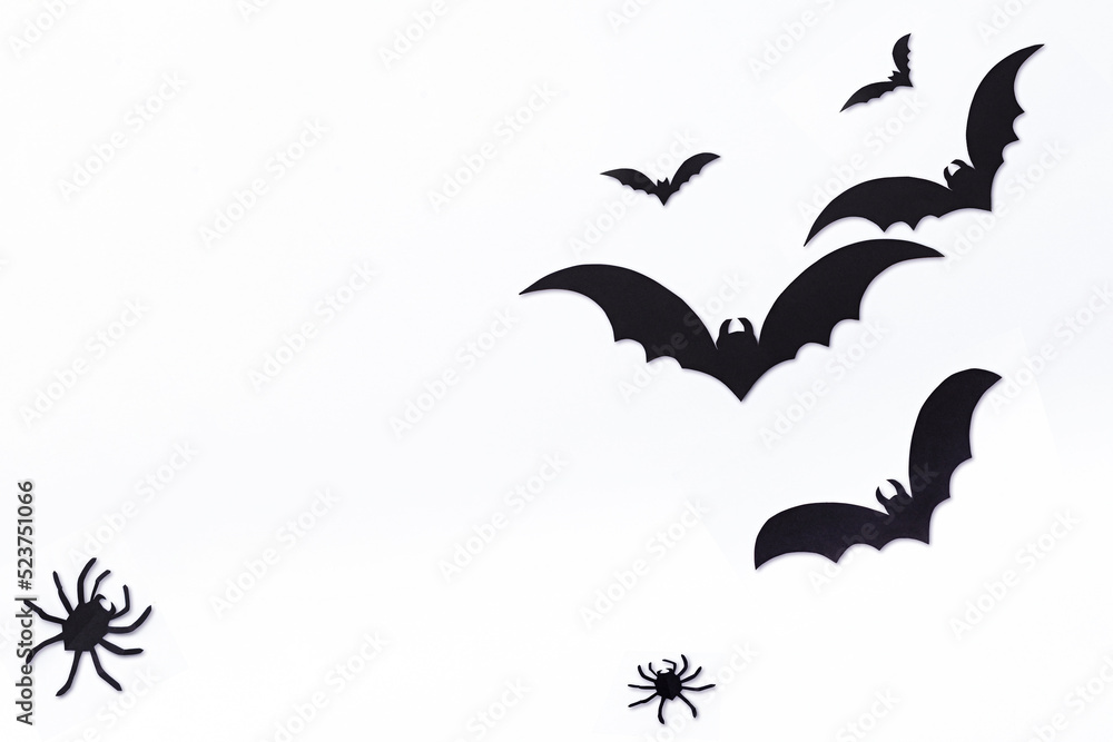 Halloween decorations concept. Halloween with spiders, black bats on white background. Flat lay, top view, copy space. Halloween decorations concept. Halloween with spiders, black bats on white background. Flat lay, top view, copy space.