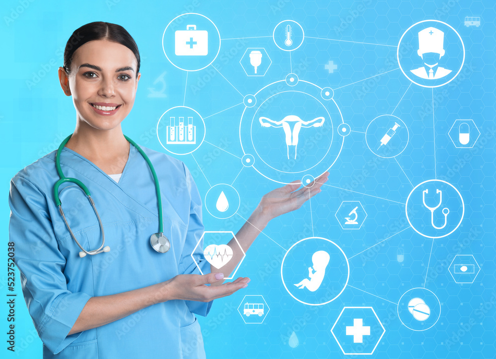 Doctor pointing at different virtual icons on blue background. Reproductive medicine concept Doctor pointing at different virtual icons on blue background. Reproductive medicine concept