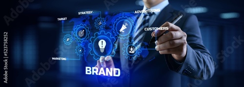 Brand development marketing strategy concept. Businessman pressing button on screen.