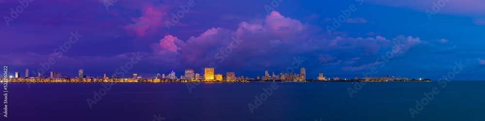 A view of Mumbai's Marine Drive closer to night with a few purple clouds. Overlooking the Back Bay, this area marks the southernmost part of the island city of Mumbai jutting out into the Arabian Sea.
