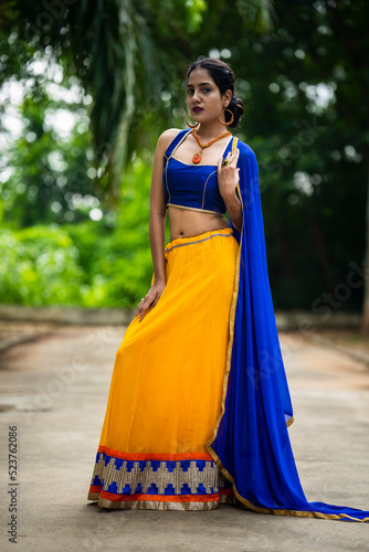 Beautiful Indian woman in traditional chaniya choli for navratri. Navratri is an Indian Festival and Chaniya choli its traditional costume