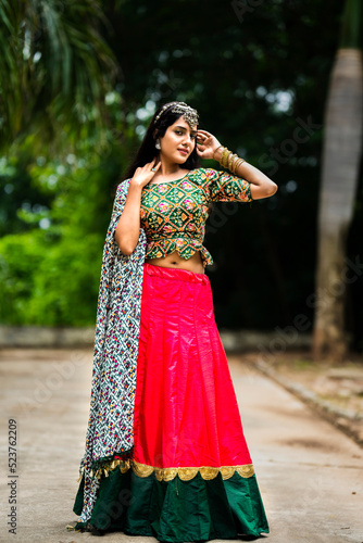 Beautiful Indian woman in traditional chaniya choli for navratri. Navratri is an Indian Festival and Chaniya choli its traditional costume