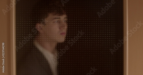 Man peeking through the door, attraction. Spy in a suit, person who secretly collects and reports information on the activities, movements, and plans of an enemy or competitor. Deviant behaviour. 