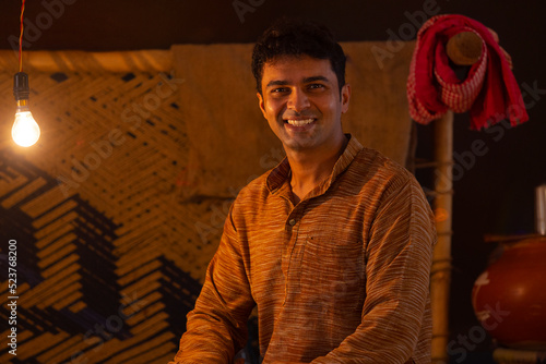 Portrait of happy man looking at camera