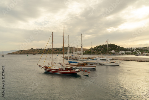 Boats, sea and mountain. Beatiful landscape at Bodrum, Turkey with cloudy sky.