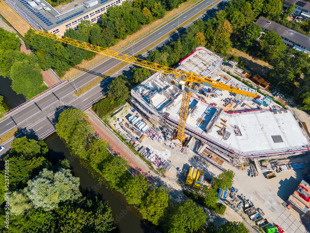 Drone point of view on Large Crane at Construction Site in Alkmaar Netherlands