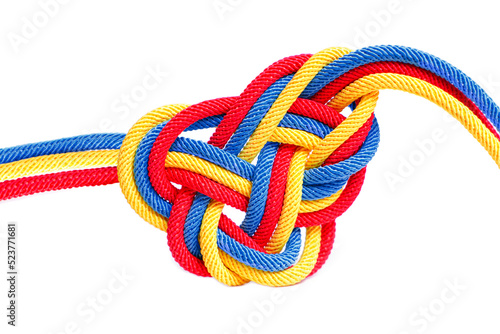 Multicolored celtic knot made from cords on white
