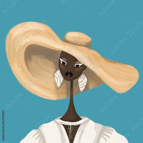 stylish african american woman portrait. african woman wearing large beige hat, summer outfit with big earrings. blue background