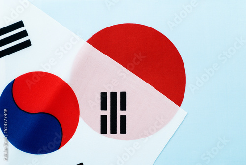 Japanese and South Korean national flags together photo